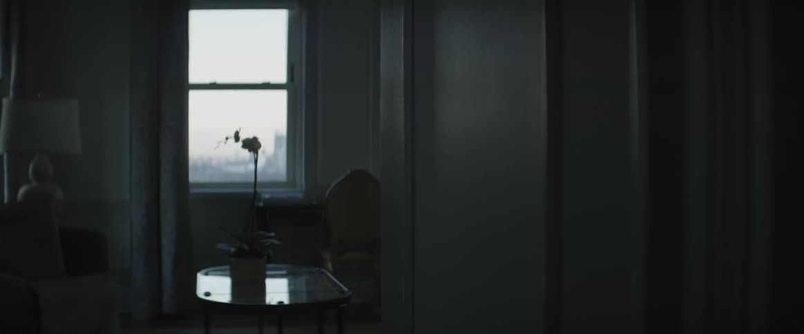 An empty apartment on the upper levels of a building is being filmed