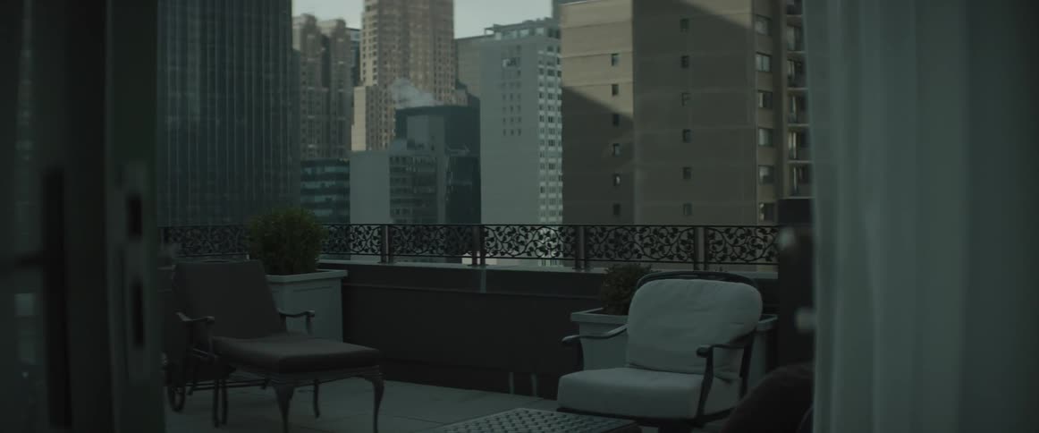 Patio furniture on a patio in a city