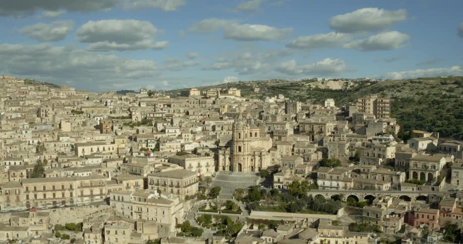 A drone flies over a old city
