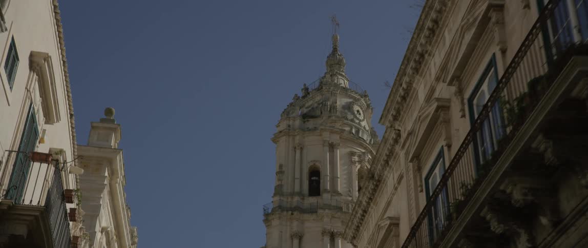 The building has a tall tower at the end