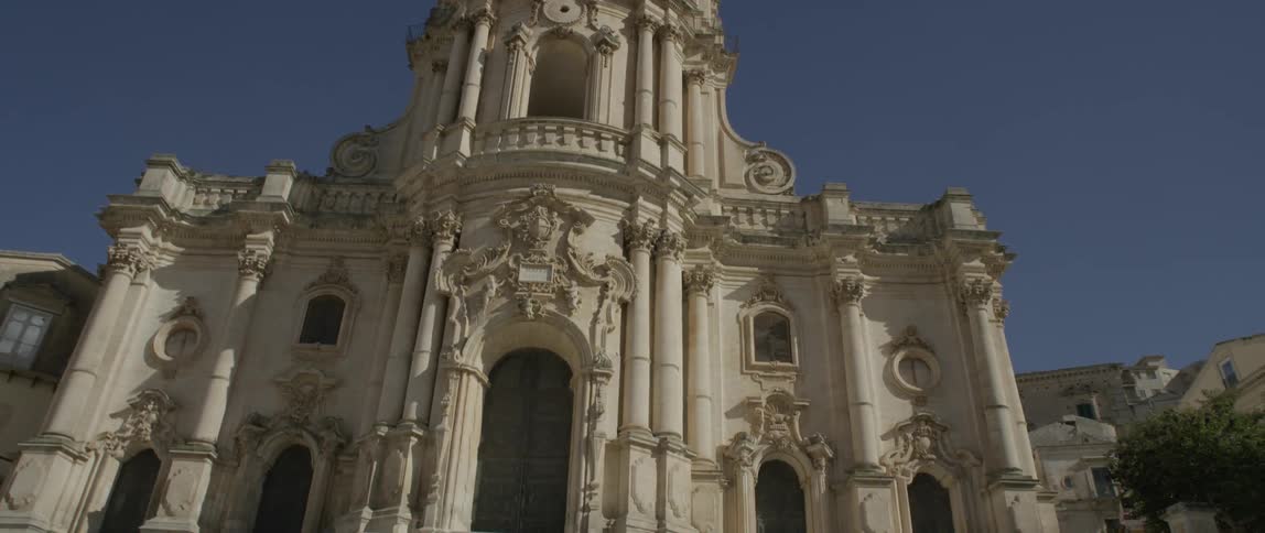 A very old cathedral is being filmed from the ground