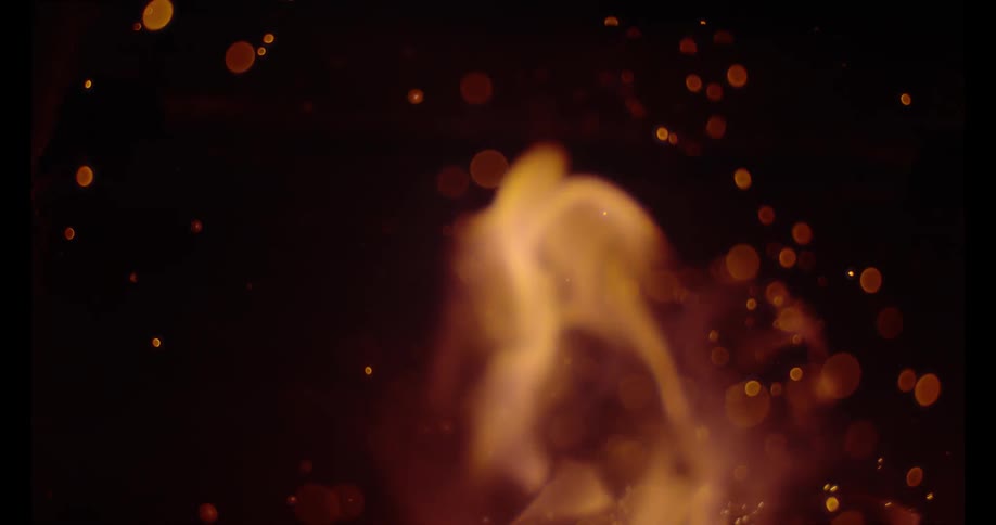 Extremely close up video of a fire at night
