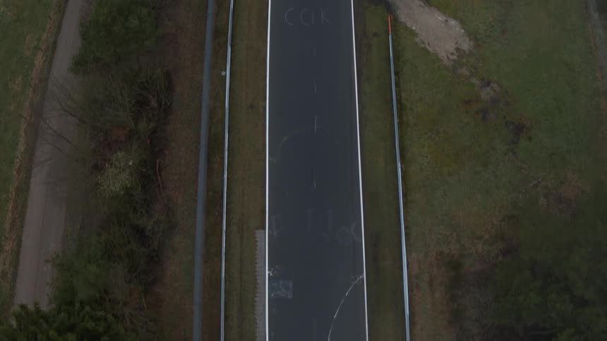 Trees sit next to a racetrack