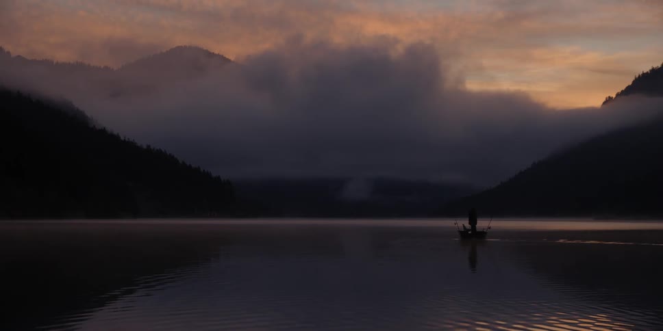 Water ripples on a mountain lake at sunset