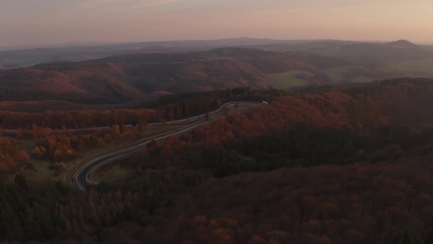 A car race course is filmed from a distance