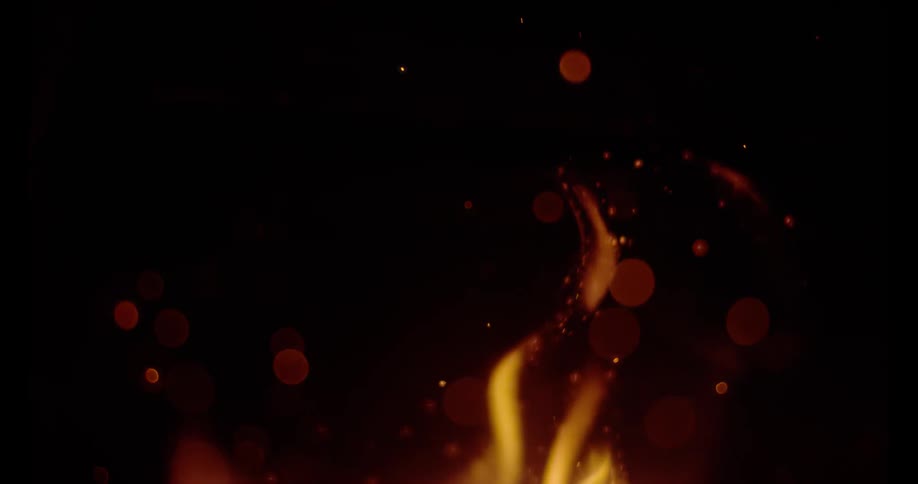 Flames are casting sparks into the darkness