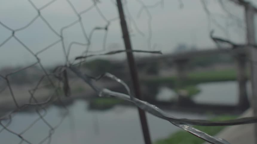 Strings of plastic on a broken fence