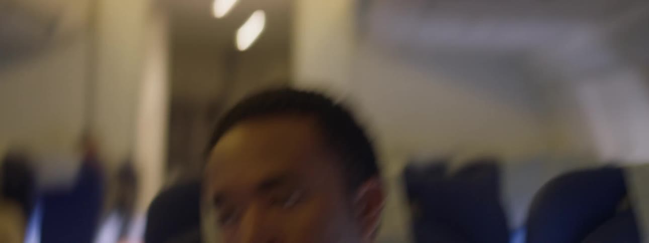 A man is startled by plane turbulence