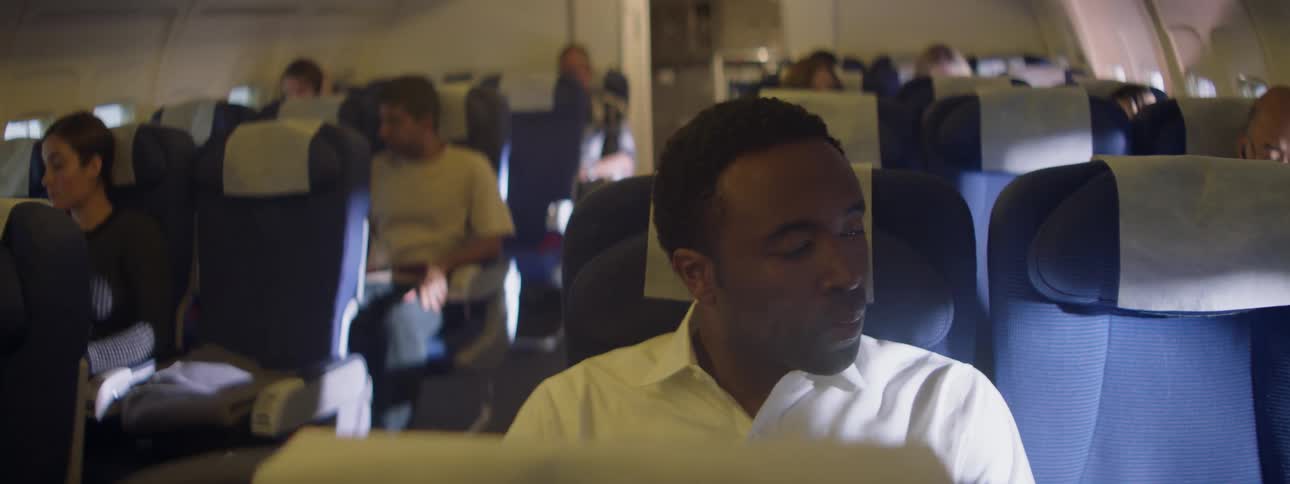 A plane full of passengers react to a bump in turbulence