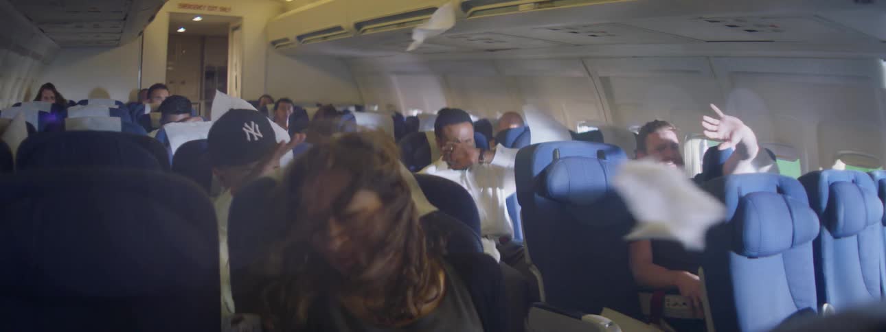 People sitting in a plane begin to experience heavy winds inside the cabin