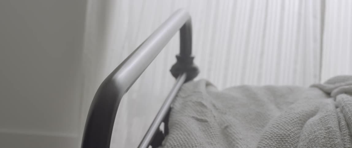 The end of the bed frame is filmed