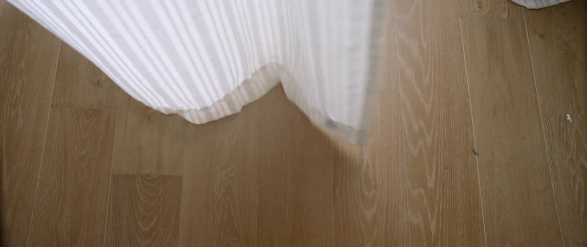 Curtains blow in a breeze
