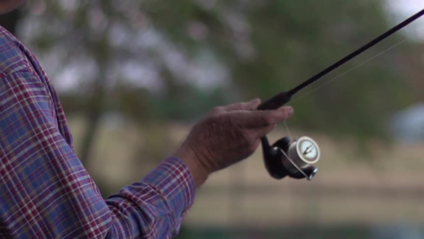A person casts a fishing rod