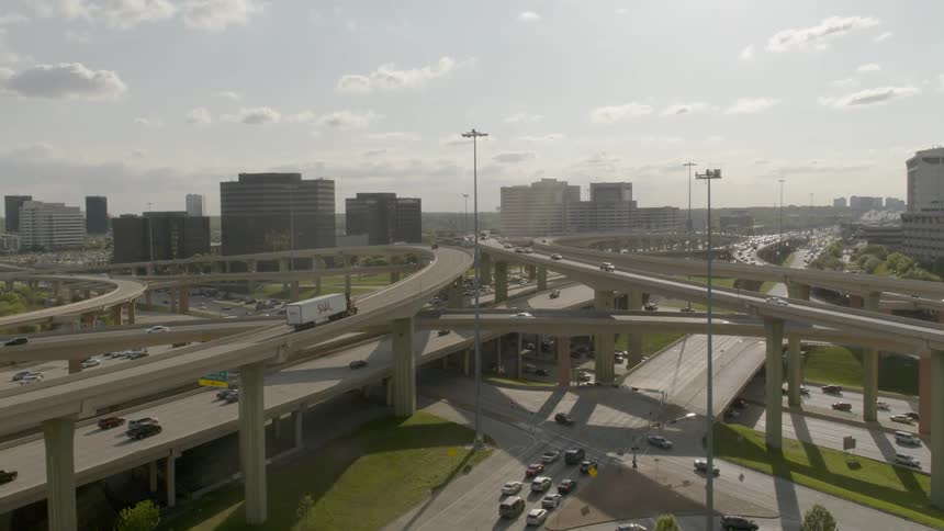 Vehicles commute along highway overpasses