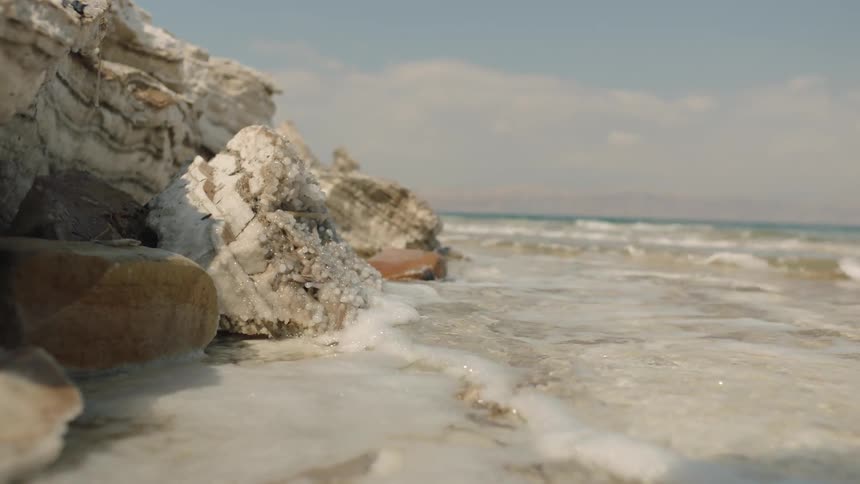 Waves crash onto the rocky shore