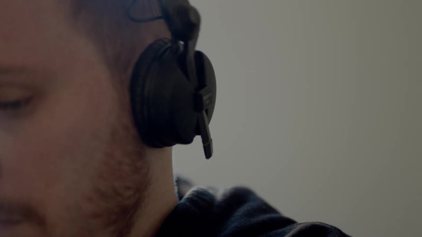 A man is wearing headphones