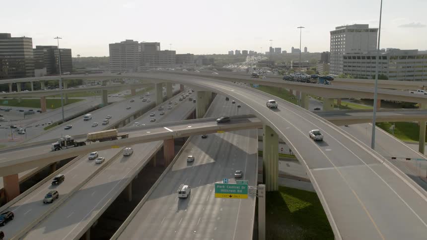 Cars travel down the interstate on a cloudy day