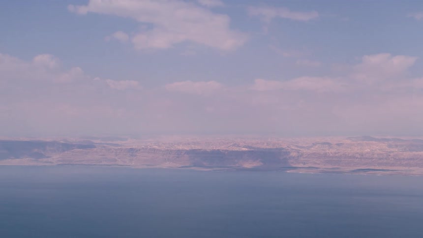 Large lake sits under a blue sky