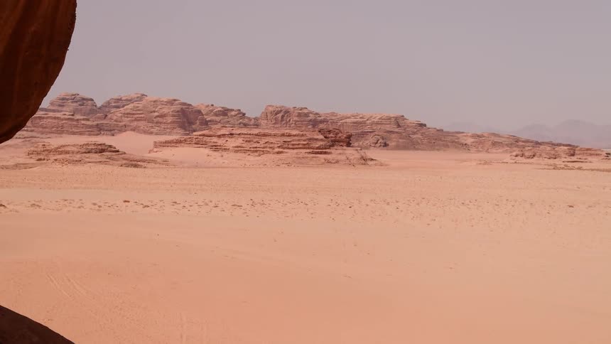 Dunes and formations stand in the desert