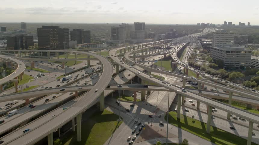 Numerous vehicles travel along various highways