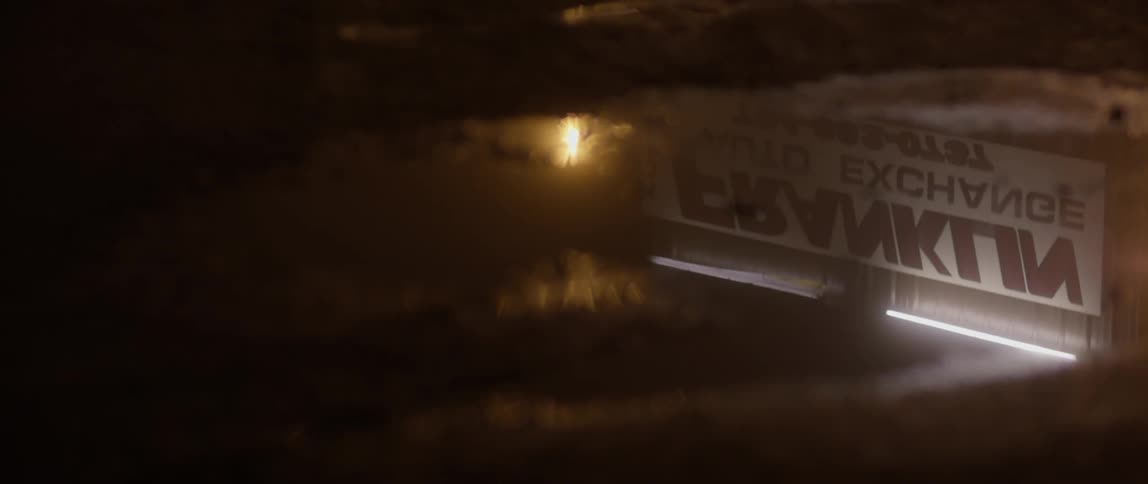 Water pools in a puddle on the asphalt