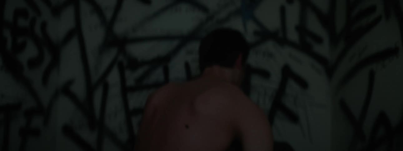 The lights blink on the wall as a man runs against it