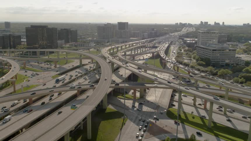 Vehicles commute along highway overpasses