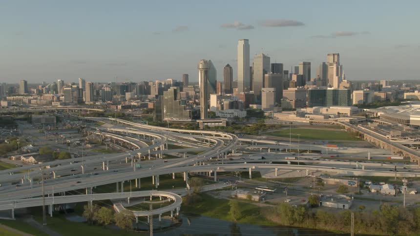 Traffic travels over the roadways under a blue sky