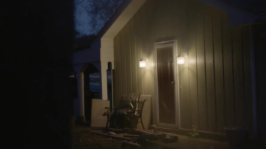 A house with two porch lights lit