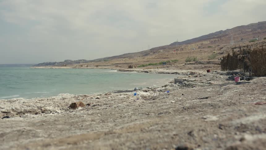 Waves gently roll in to a rocky shore