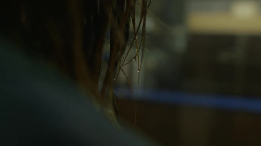 Water drips from someone's hair