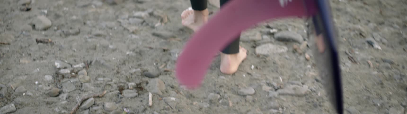 Someone walks barefoot over the rocks