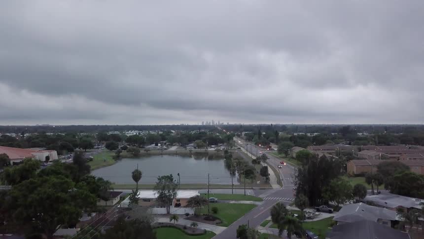 A town is being flown over and filmed by a drone