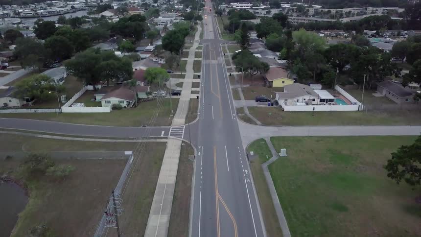 A long road runs through this town with only one car on it
