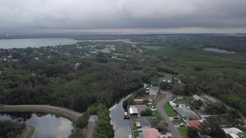 A small suburb is being filmed from a drone