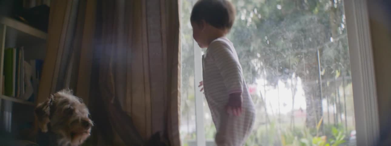 An infant walks on the floor