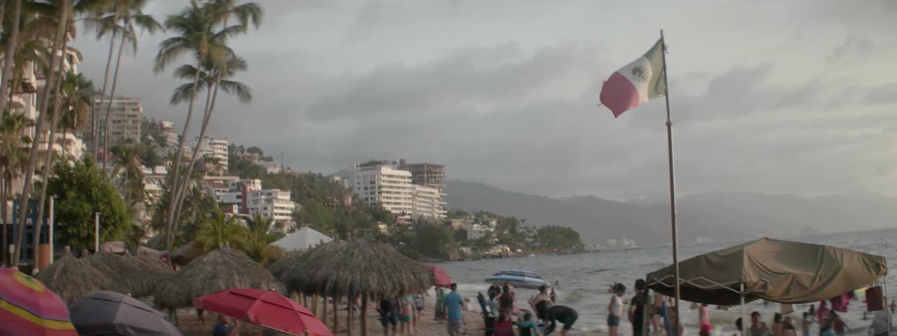 People are standing on a busy beach