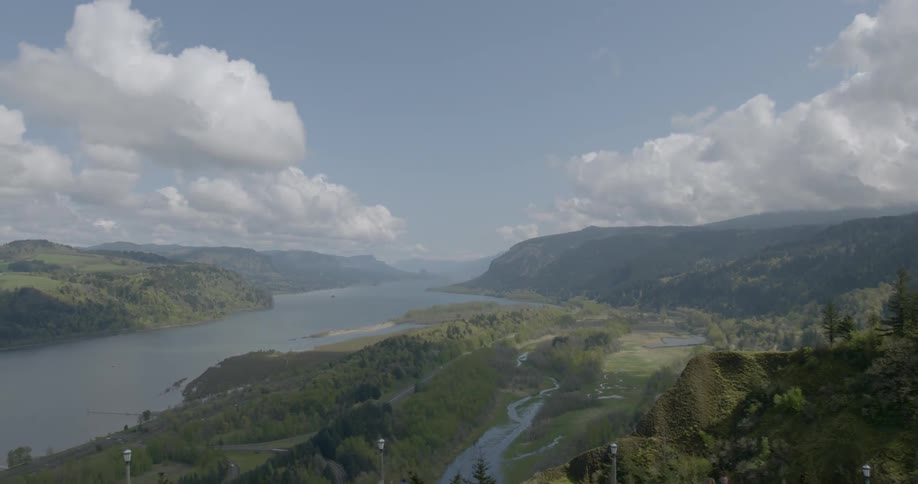 A river with mountains and the sky in the background