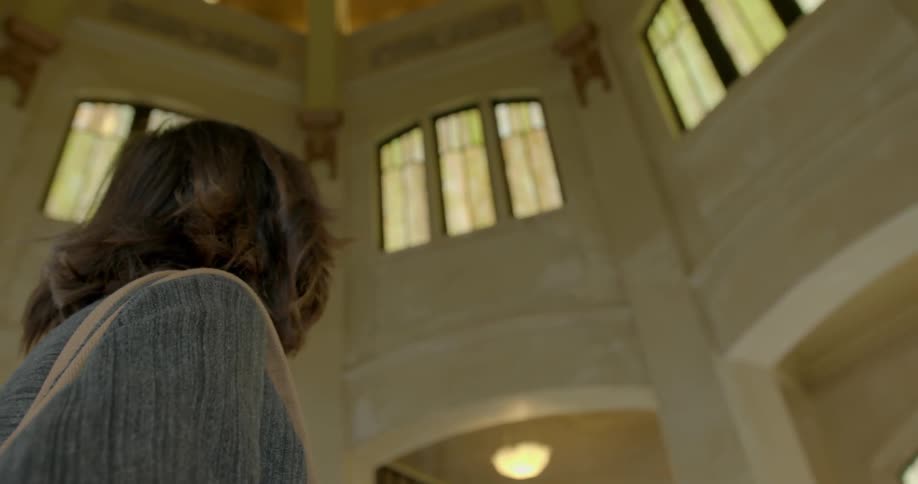 A woman stands in a building