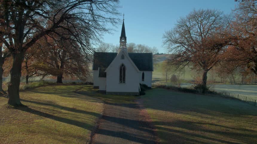 Small Anglican church in rural setting at dawn