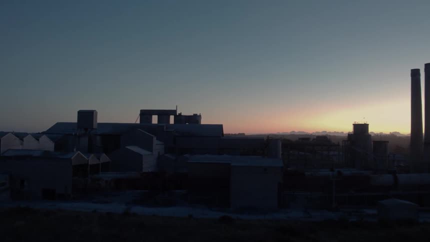 Cement factory in rural area at dawn