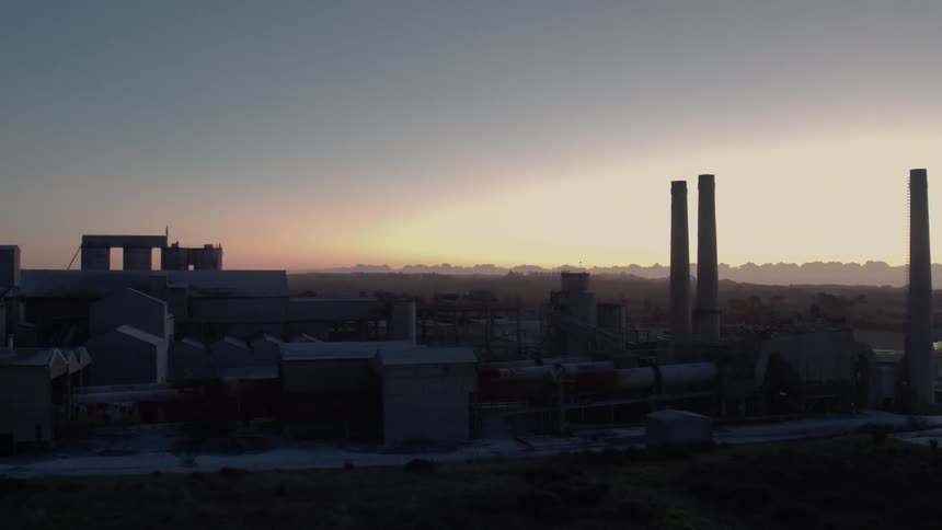 An industrial building at sunrise