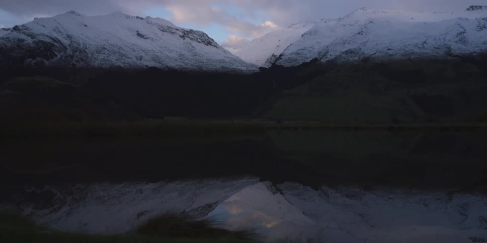 A snow covered mountain on a winter day