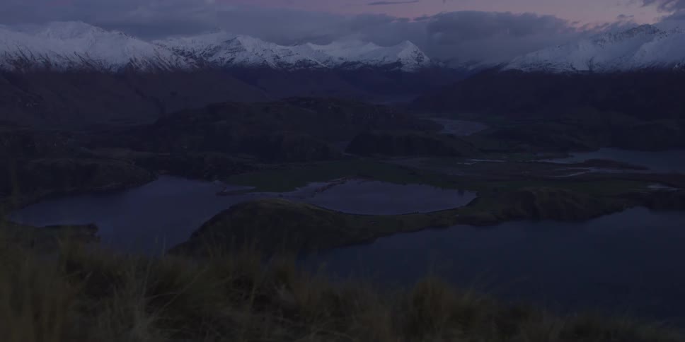 An aerial view of lakes beneath the mountains