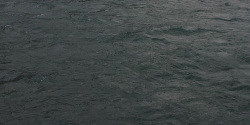 Water flowing and rippling in a river