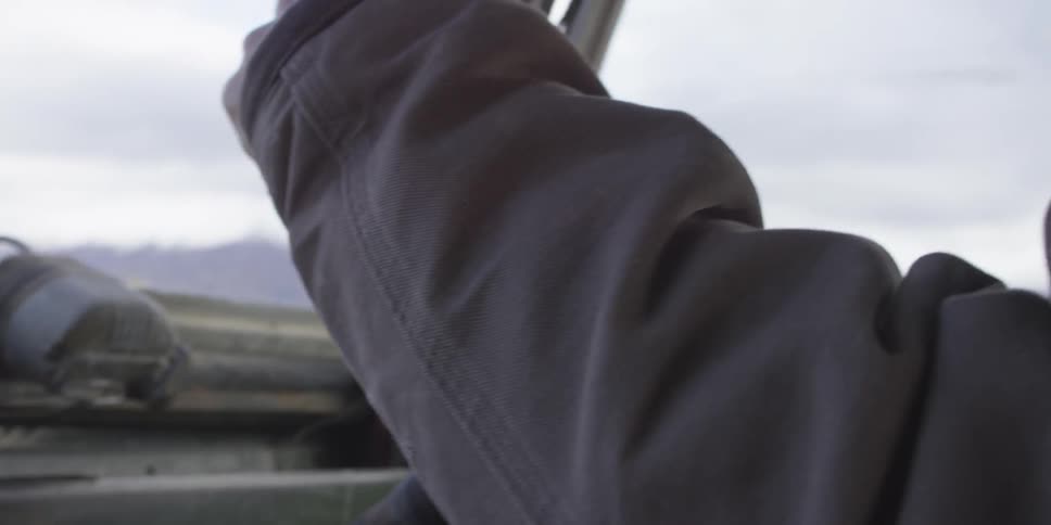 A hand on a lever in a vehicle