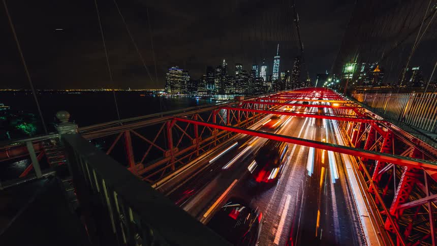 Highway traffic lights blur at night