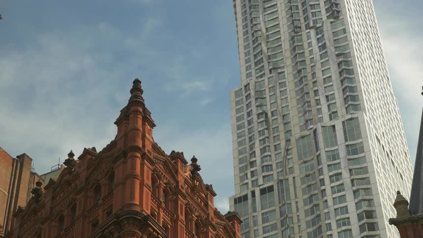 Tall city buildings tower into the sky