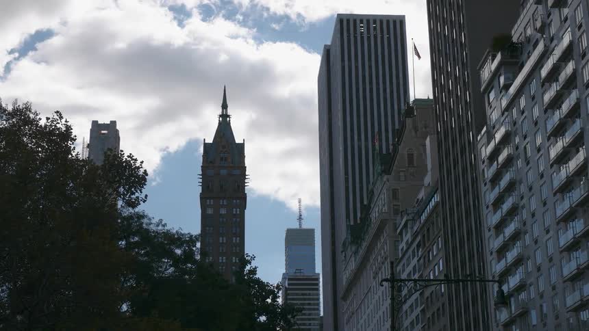 The city street is lined with tall buildings