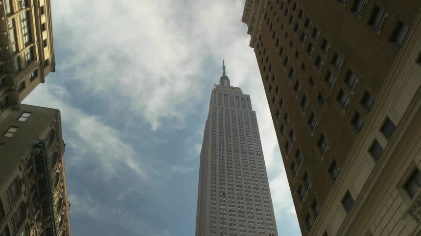 The city is full of tall buildings on a cloudy day